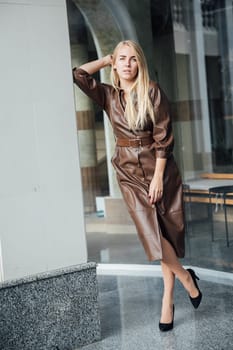 a beautiful blonde woman in a shop on the street