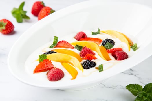 fruit salad with wild berries and strawberries