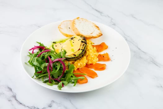 a mix of salmon, arugula salad, white bread and baked avocado with cheese