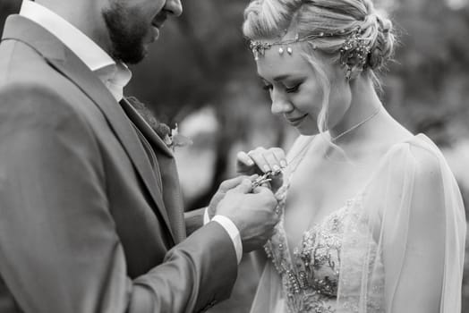 the first meeting of the bride and groom in wedding outfits in the park