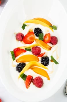 fruit salad with wild berries and strawberries