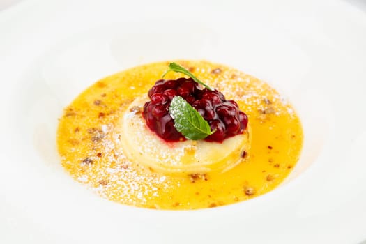 Ginger pumpkin soup with dumplings and berries. White background