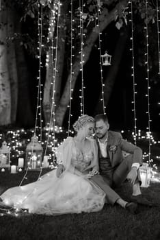 night wedding ceremony of the newlyweds in a country cottage on a green hill