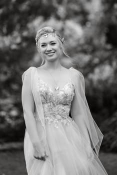 the first meeting of the bride and groom in wedding outfits in the park