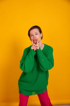 slender woman in green knitted autumn sweater