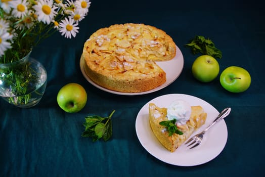 beautiful apple pie on the table with flowers in 4k