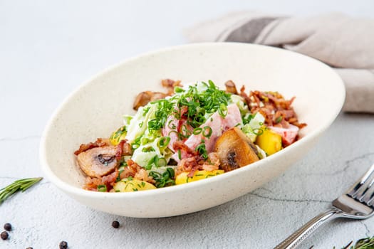 salad with potatoes, rice, meat and green onions