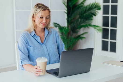 woman secretary working online at desk in office