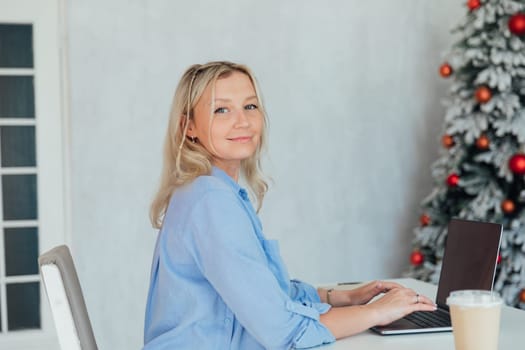 woman working behind computer in christmas office