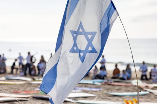 Officially flag of Israel on sea - telephoto
