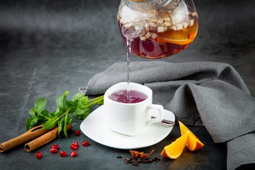 hot homemade tea with cinnamon, lemon and mint