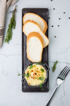 Julienne in a mug with pieces of bread