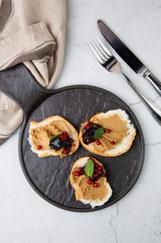 canapes with pate, mint leaves and berries