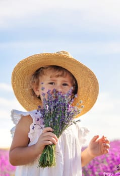 Child in a lavender field. Selective focus. Nature.