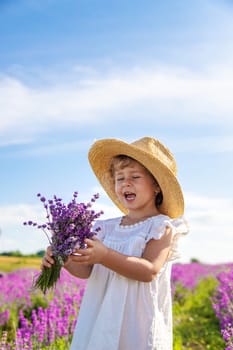 Child in a lavender field. Selective focus. Nature.