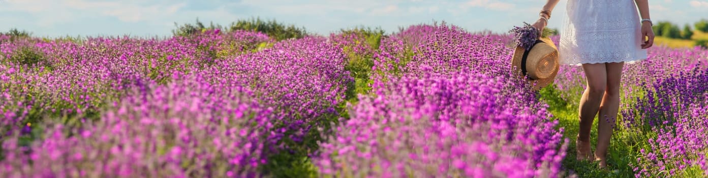 Woman in a lavender field. Selective focus. Nature.