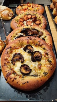 round pizza with eggplants and olives, food, baking, cooking. High quality photo
