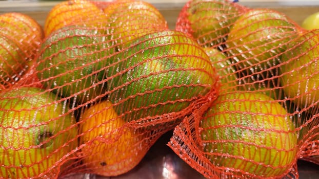 tangerines fresh fruit in a net, food, products. High quality photo