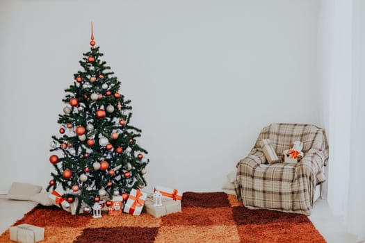 Christmas tree on new year's Eve in a white room with Christmas gifts 1