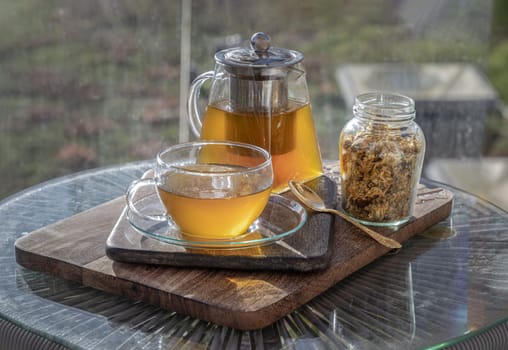 Chinese chrysanthemum flower tea and Dried chrysanthemum flower on wooden cutting board. Healthy beverage for drink. Herbs and medical concept. Space for text, Selective focus.