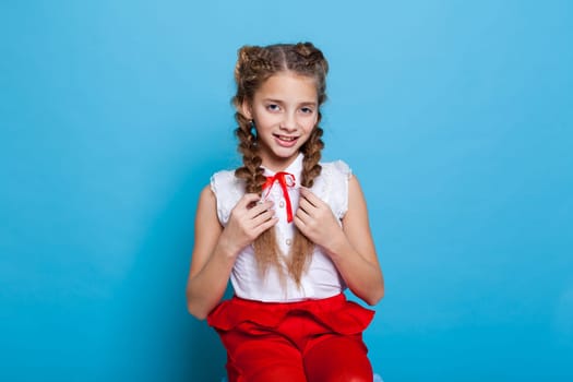 girl in red white dress on a blue background