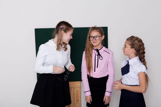 schoolgirls in class at the school board