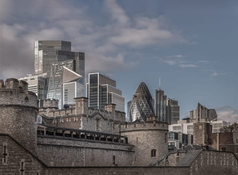 London, UK - Nov 07, 2023 - Exterior view of Tower of London with Skyscrapers background. Architectural of Historic Building and New building in Contrasting Classical and Modern Design, Copy space, Selective focus.