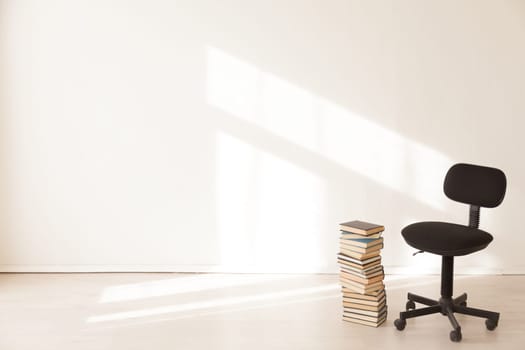 black office chair with a gift in an empty office