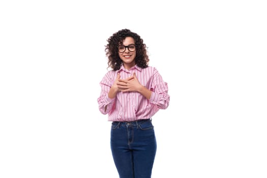 young slender caucasian female leader dressed in a pink striped oversized shirt.