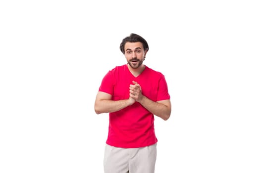 young man dressed in a red t-shirt with a mockup for an identity on a white background.