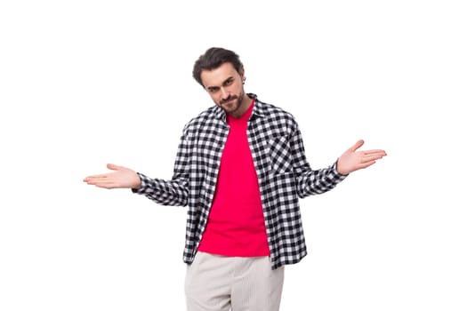 young nice european brutal guy with gorgeous hair and beard on a white background with copy space.