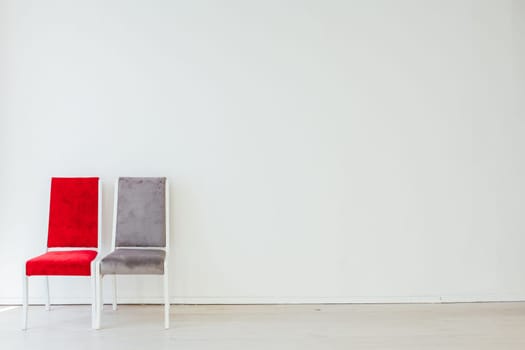 two chairs in an empty white room