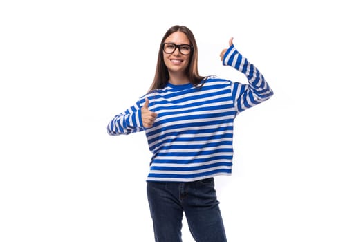 young slim brunette lady in a blue striped casual jacket on a white background with copy space.