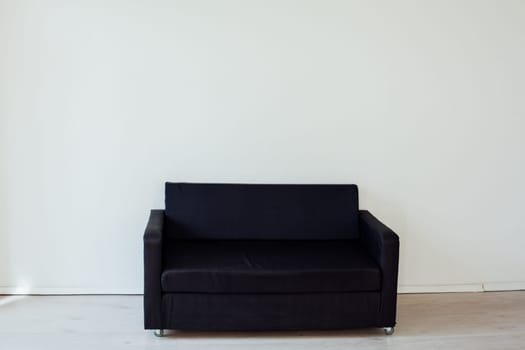 black sofa in the interior of an empty room