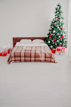 Interior bedroom with bed and Christmas tree new year holidays
