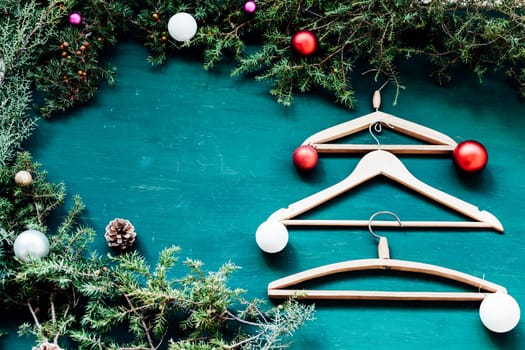 hangers from the wardrobe of clothes on Christmas new year tree background
