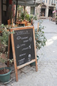 Cafe menu on black board outdoor .