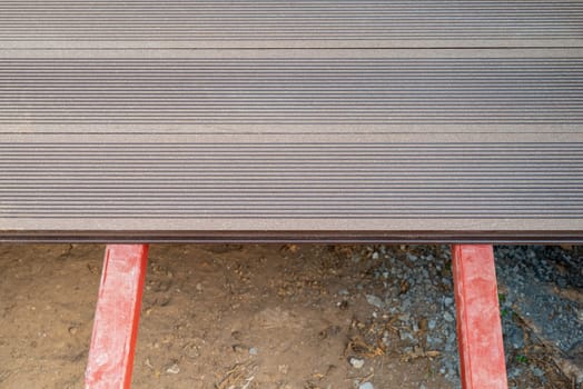 Brown WPC composite deck flooring mounted on steel profile