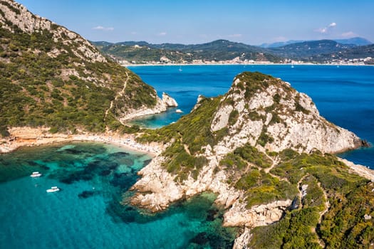 Porto Timoni is an amazing beautiful double beach in Corfu, Greece. Porto Timoni beach at Afionas is a paradise double beach with crystal clear azure water in Corfu, Ionian island, Greece, Europe