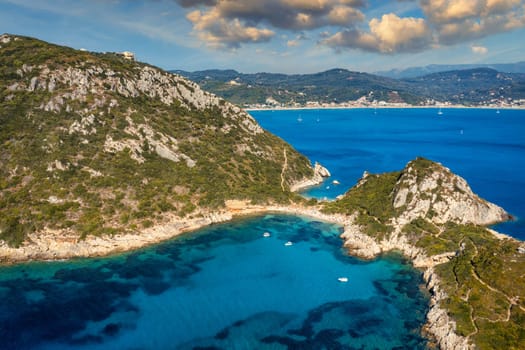 Porto Timoni is an amazing beautiful double beach in Corfu, Greece. Porto Timoni beach at Afionas is a paradise double beach with crystal clear azure water in Corfu, Ionian island, Greece, Europe