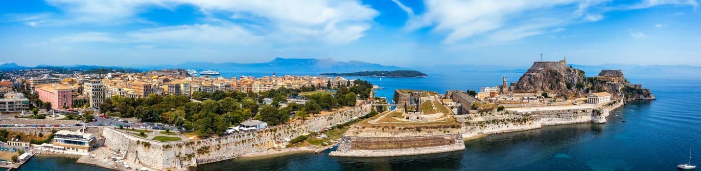 Panoramic view of Kerkyra, capital of Corfu island, Greece. Aerial drone view of Kerkyra with beautiful buildings during summer sunny day. Corfu island, Greece. 