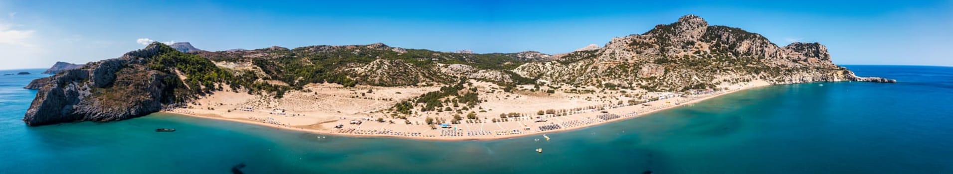 Tsampika beach with golden sand view from above, Rhodes, Greece. Aerial birds eye view of famous beach of Tsampika, Rhodes island, Dodecanese, Greece