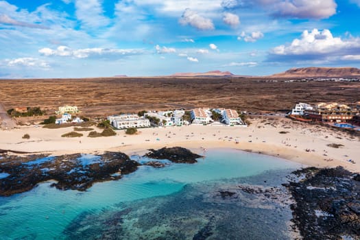 View of the beautiful Playa Chica Beach, El Cotillo, Fuerteventura, Canary Islands, Spain. White sand beach and turquoise blue water La Concha beach in El Cotillo, Fuerteventura, Canary Islands