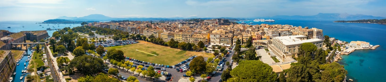 Panoramic view of Kerkyra, capital of Corfu island, Greece. Aerial drone view of Kerkyra with beautiful buildings during summer sunny day. Corfu island, Greece. 