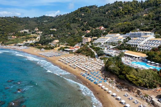 Aerial drone view over western coast and Glyfada beach, Island of Corfu, Greece. Glyfada Beach at Corfu Greece during the day. 