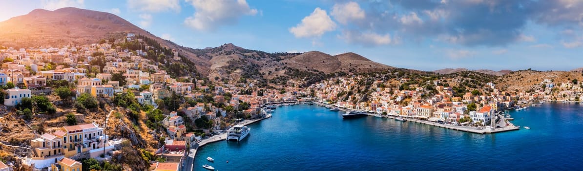 Aerial view of the beautiful greek island of Symi (Simi) with colourful houses and small boats. Greece, Symi island, view of the town of Symi (near Rhodes), Dodecanese.