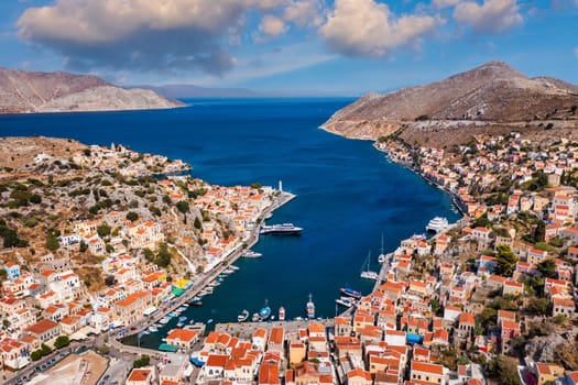 Aerial view of the beautiful greek island of Symi (Simi) with colourful houses and small boats. Greece, Symi island, view of the town of Symi (near Rhodes), Dodecanese.
