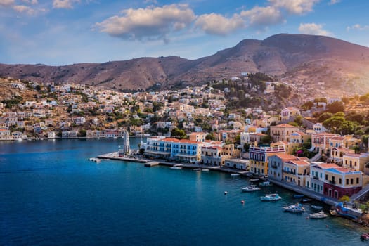 Aerial view of the beautiful greek island of Symi (Simi) with colourful houses and small boats. Greece, Symi island, view of the town of Symi (near Rhodes), Dodecanese.