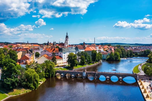 Medieval Town Pisek and historic stone bridge over river Otava in the Southern Bohemia, Czech Republic. Pisek Stone Bridge, the oldest preserved early Gothic bridge in the Czech republic.