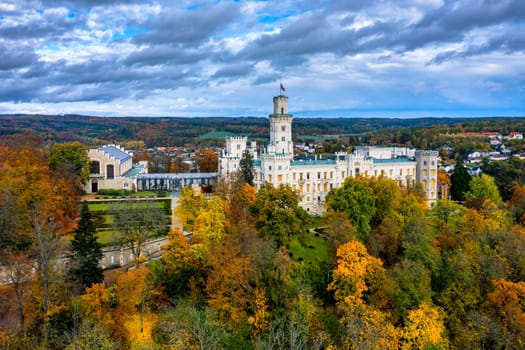 Castle Hluboka nad Vltavou is one of the most beautiful castles in Czech Republic. Castle Hluboka nad Vltavou in autumn with red foliage, Czechia. Colorful autumn view of Hluboka nad Vltavou castle.